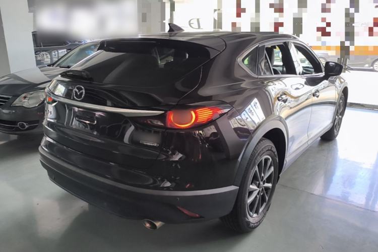 Used Mazda CX-4 2021 2.0L Automatic Two-Wheel Drive Blue Sky Dynamic Edition Rear Right 45 Deg