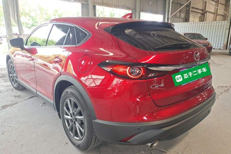 Used Mazda CX-4 2021 2.0L Automatic Two-Wheel Drive Blue Sky Dynamic Edition Rear Left 45 Deg