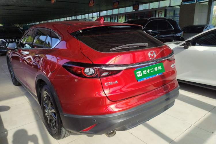 Used Mazda CX-4 2021 2.0L Automatic Two-Wheel Drive Blue Sky Dynamic Edition Rear Left 45 Deg