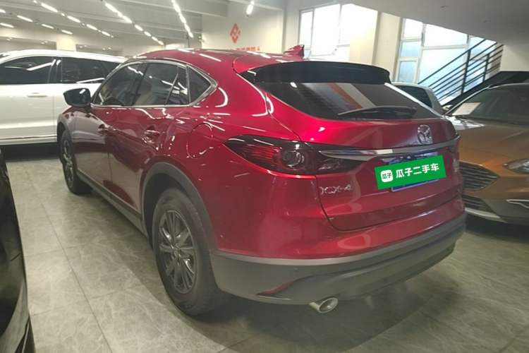 Used Mazda CX-4 2021 2.0L Automatic Two-Wheel Drive Blue Sky Dynamic Edition Rear Left 45 Deg