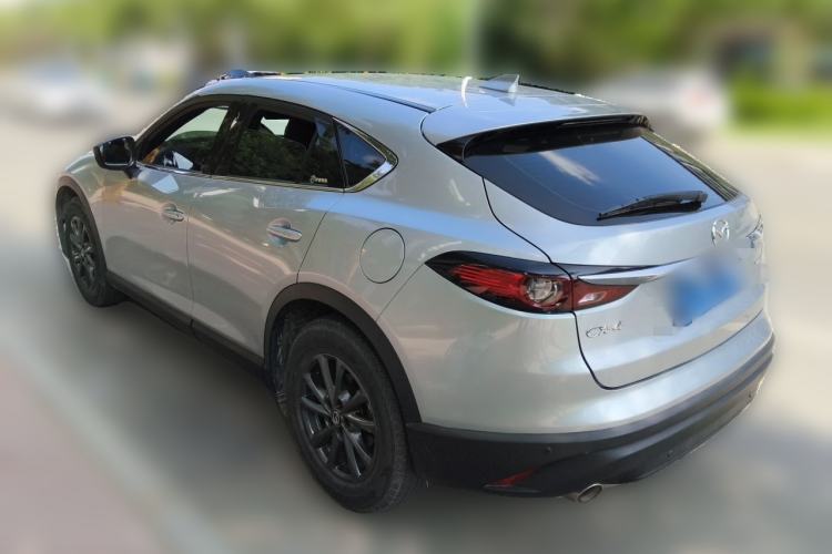 Used Mazda CX-4 2021 2.0L Automatic Two-Wheel Drive Blue Sky Dynamic Edition Rear Left 45 Deg