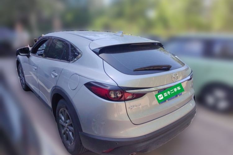 Used Mazda CX-4 2021 2.0L Automatic Two-Wheel Drive Blue Sky Dynamic Edition Rear Left 45 Deg