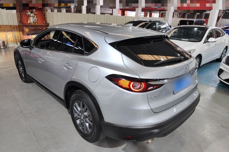 Used Mazda CX-4 2021 2.0L Automatic Two-Wheel Drive Blue Sky Dynamic Edition Rear Left 45 Deg