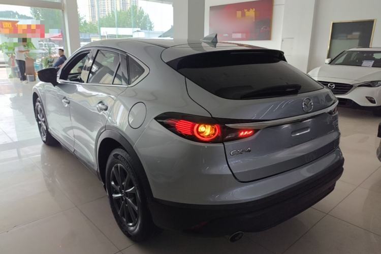 Used Mazda CX-4 2021 2.0L Automatic Two-Wheel Drive Blue Sky Dynamic Edition Rear Left 45 Deg