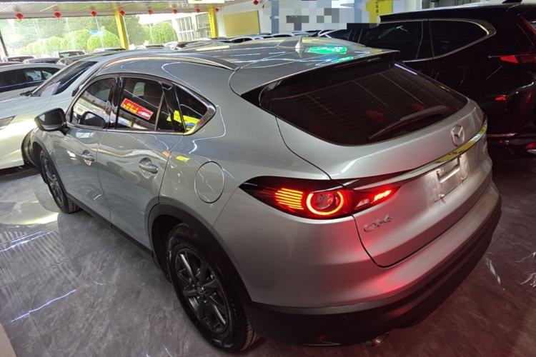 Used Mazda CX-4 2021 2.0L Automatic Two-Wheel Drive Blue Sky Dynamic Edition Rear Left 45 Deg