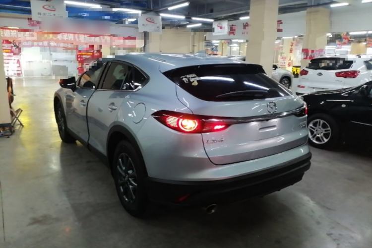 Used Mazda CX-4 2021 2.0L Automatic Two-Wheel Drive Blue Sky Dynamic Edition Rear Left 45 Deg