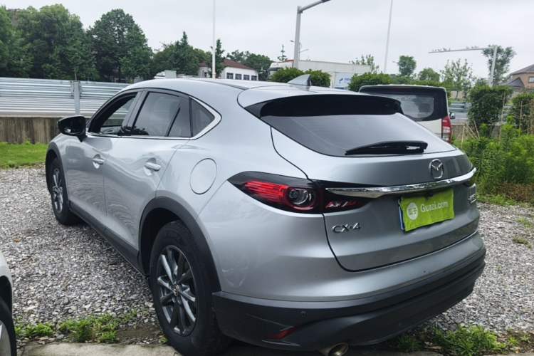 Used Mazda CX-4 2021 2.0L Automatic Two-Wheel Drive Blue Sky Dynamic Edition Rear Left 45 Deg