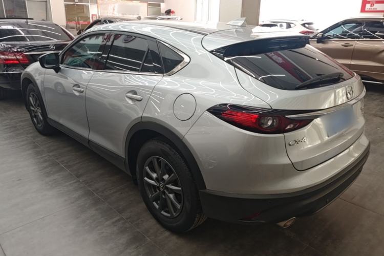 Used Mazda CX-4 2021 2.0L Automatic Two-Wheel Drive Blue Sky Dynamic Edition Rear Left 45 Deg