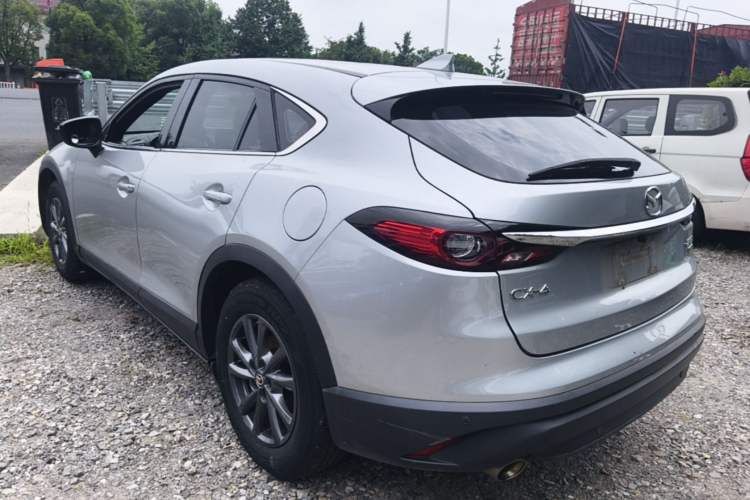 Used Mazda CX-4 2021 2.0L Automatic Two-Wheel Drive Blue Sky Dynamic Edition Rear Left 45 Deg