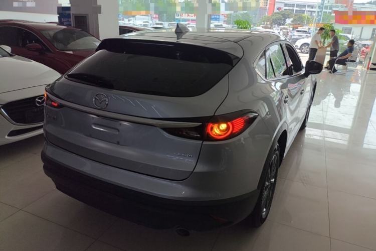 Used Mazda CX-4 2021 2.0L Automatic Two-Wheel Drive Blue Sky Dynamic Edition Rear Right 45 Deg