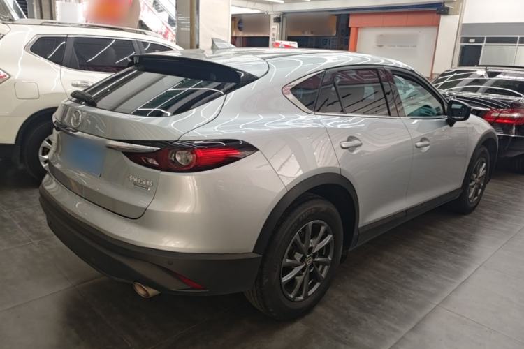 Used Mazda CX-4 2021 2.0L Automatic Two-Wheel Drive Blue Sky Dynamic Edition Rear Right 45 Deg