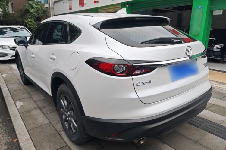 Used Mazda CX-4 2021 2.0L Automatic Two-Wheel Drive Blue Sky Dynamic Edition Rear Left 45 Deg
