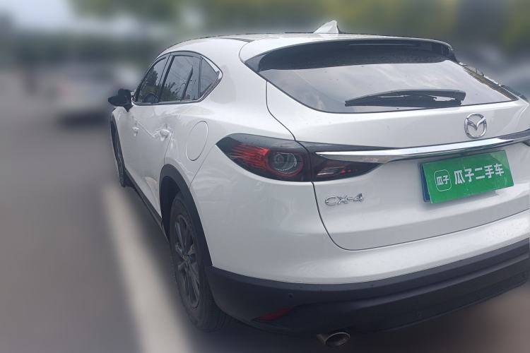 Used Mazda CX-4 2021 2.0L Automatic Two-Wheel Drive Blue Sky Exploration Edition Rear Left 45 Deg