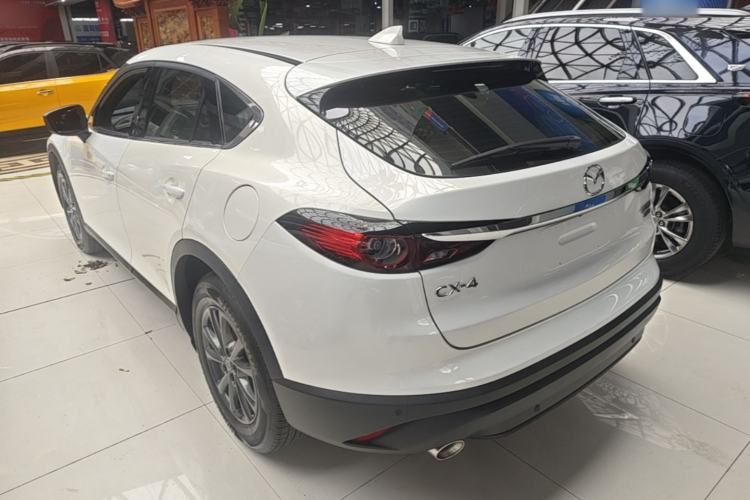 Used Mazda CX-4 2021 2.0L Automatic Two-Wheel Drive Blue Sky Dynamic Edition Rear Left 45 Deg