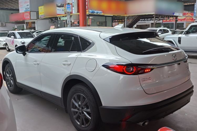 Used Mazda CX-4 2021 2.0L Automatic Two-Wheel Drive Blue Sky Dynamic Edition Rear Left 45 Deg