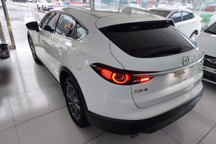 Used Mazda CX-4 2021 2.0L Automatic Two-Wheel Drive Blue Sky Luxury Edition Rear Left 45 Deg