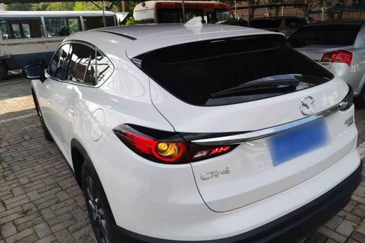 Used Mazda CX-4 2021 2.0L Automatic Two-Wheel Drive Blue Sky Dynamic Edition Rear Left 45 Deg