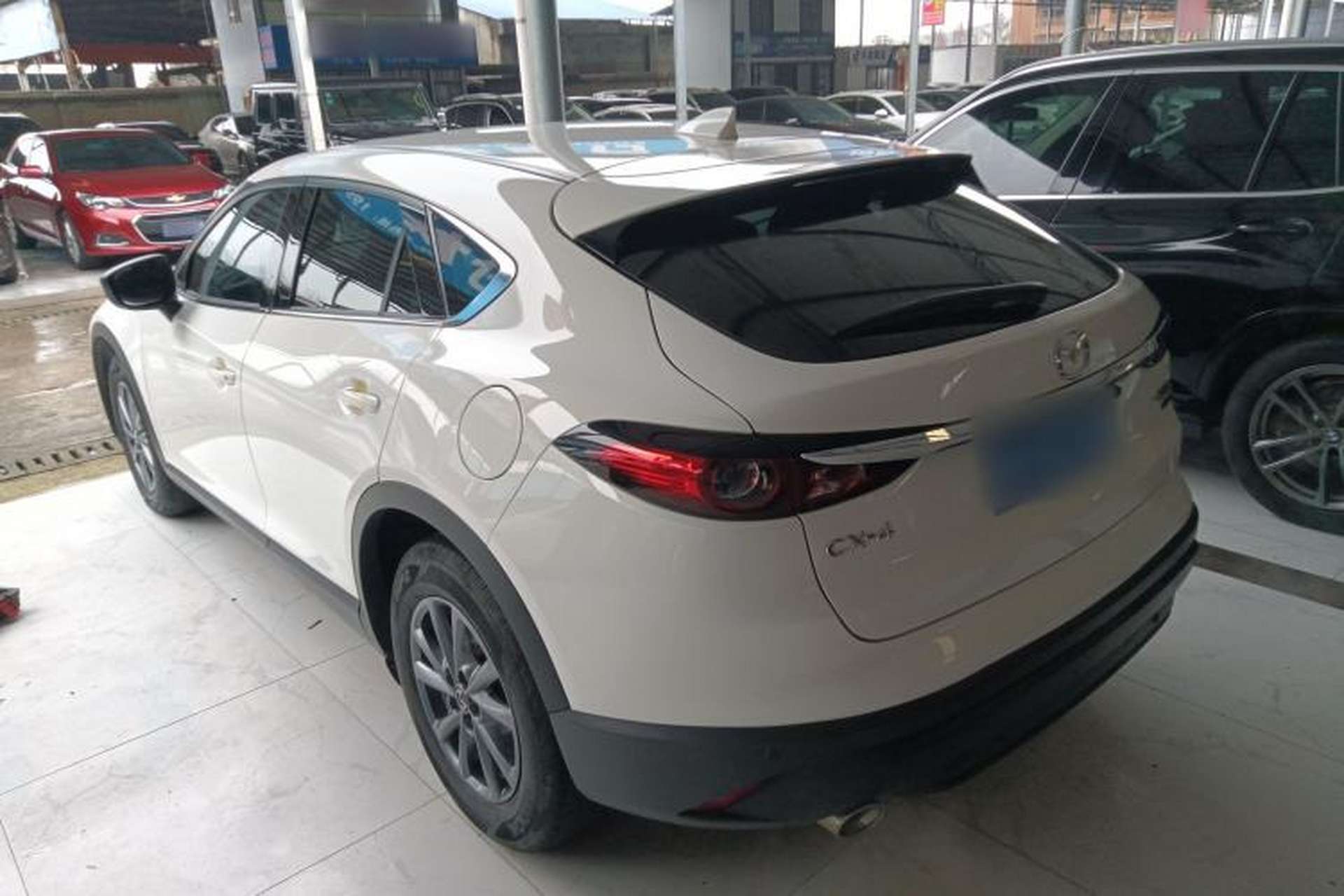 Used Mazda CX-4 2021 2.0L Automatic Two-Wheel Drive Blue Sky Dynamic Edition Rear Left 45 Deg