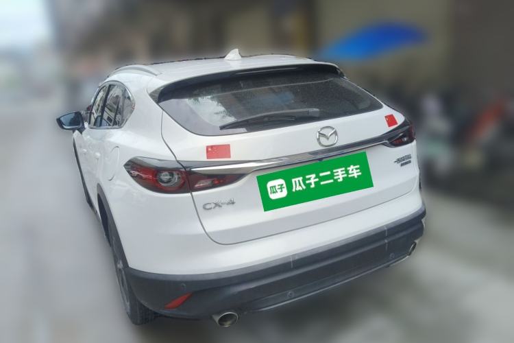 Used Mazda CX-4 2021 2.0L Automatic Two-Wheel Drive Blue Sky Dynamic Edition Rear Left 45 Deg