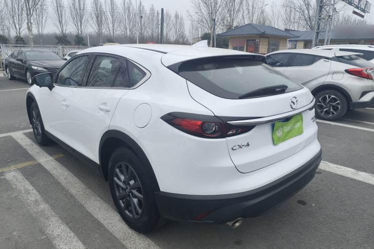 Used Mazda CX-4 2021 2.0L Automatic Two-Wheel Drive Blue Sky Dynamic Edition Rear Left 45 Deg
