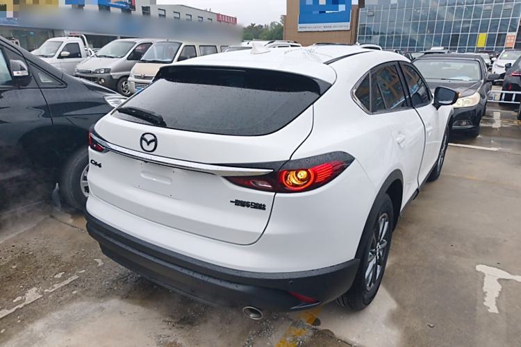 Used Mazda CX-4 2021 2.0L Automatic Two-Wheel Drive Blue Sky Dynamic Edition Rear Right 45 Deg