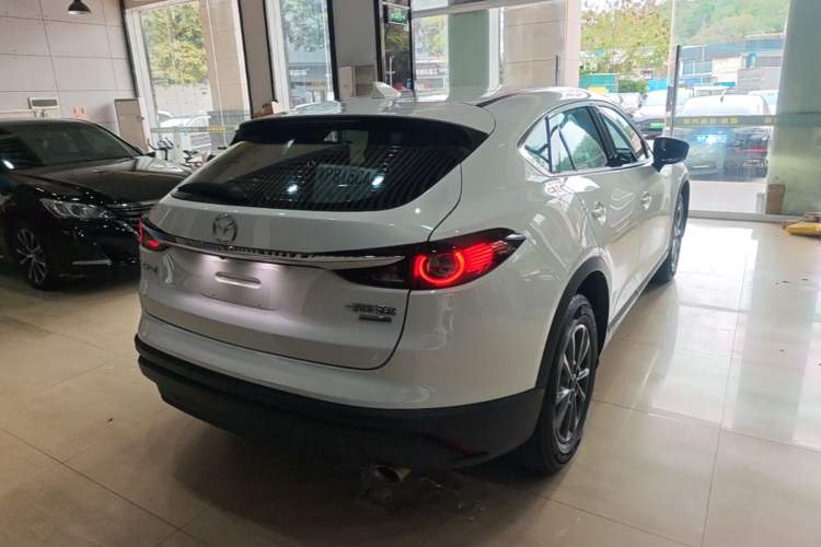 Used Mazda CX-4 2021 2.0L Automatic Two-Wheel Drive Blue Sky Exploration Edition Rear Right 45 Deg