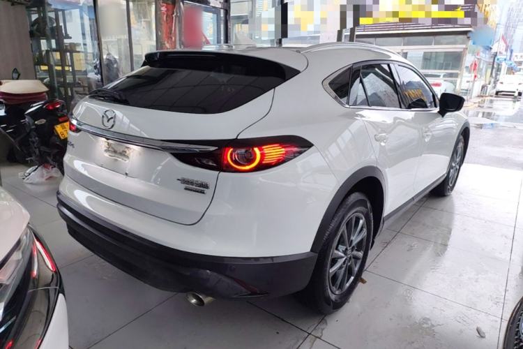 Used Mazda CX-4 2021 2.0L Automatic Two-Wheel Drive Blue Sky Luxury Edition Rear Right 45 Deg