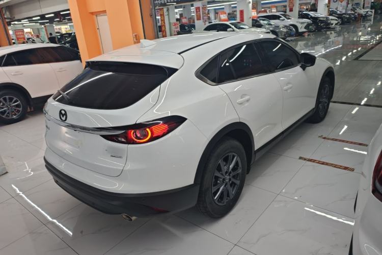 Used Mazda CX-4 2021 2.0L Automatic Two-Wheel Drive Blue Sky Dynamic Edition Rear Right 45 Deg