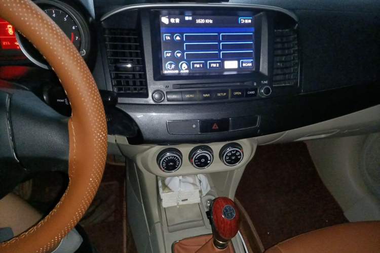 Used Mitsubishi Lancer EX 2011 Chasing Edition 1.8L Manual Luxury Model Audio And AC Panel